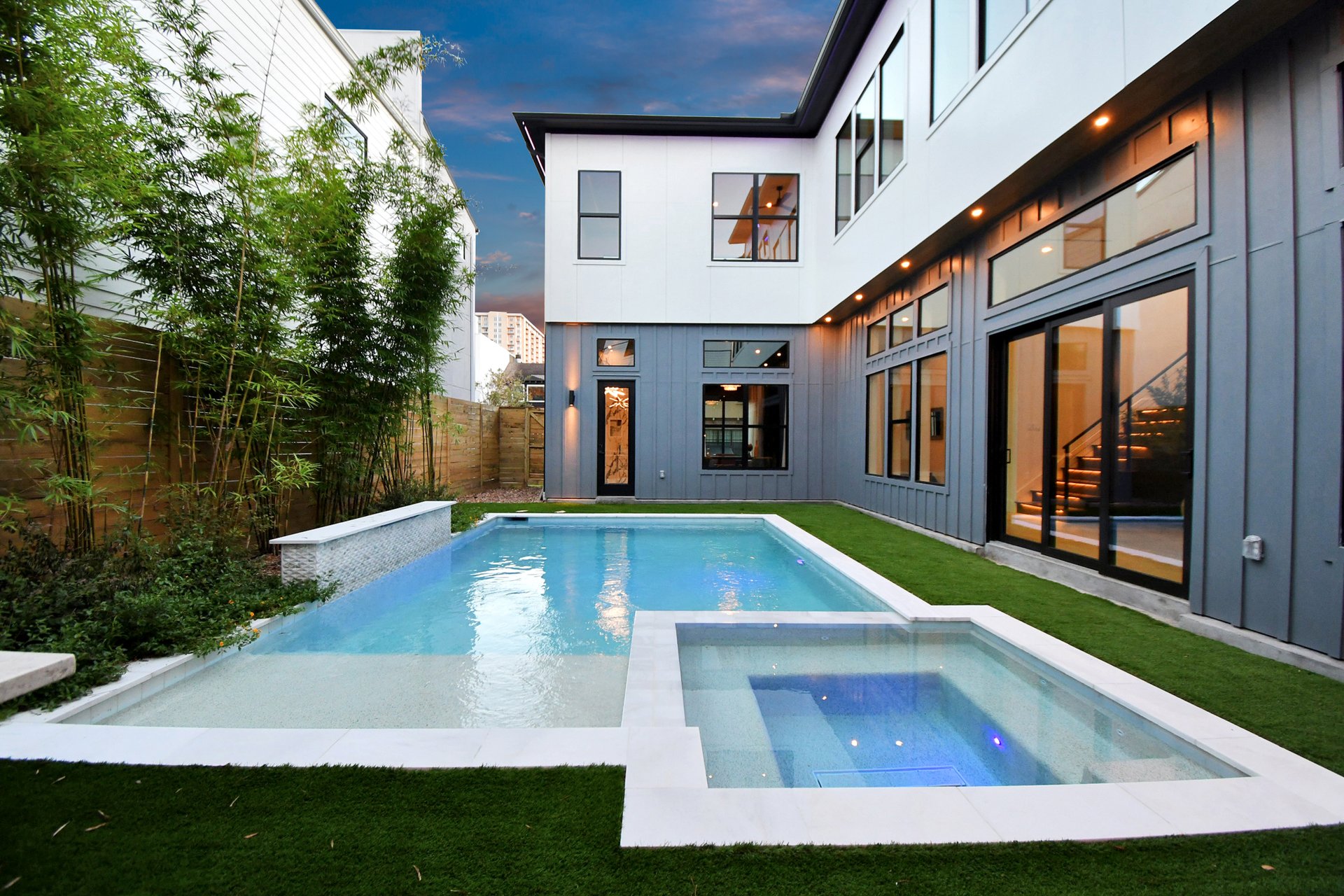 Courtyard pool and spa from the side, evening