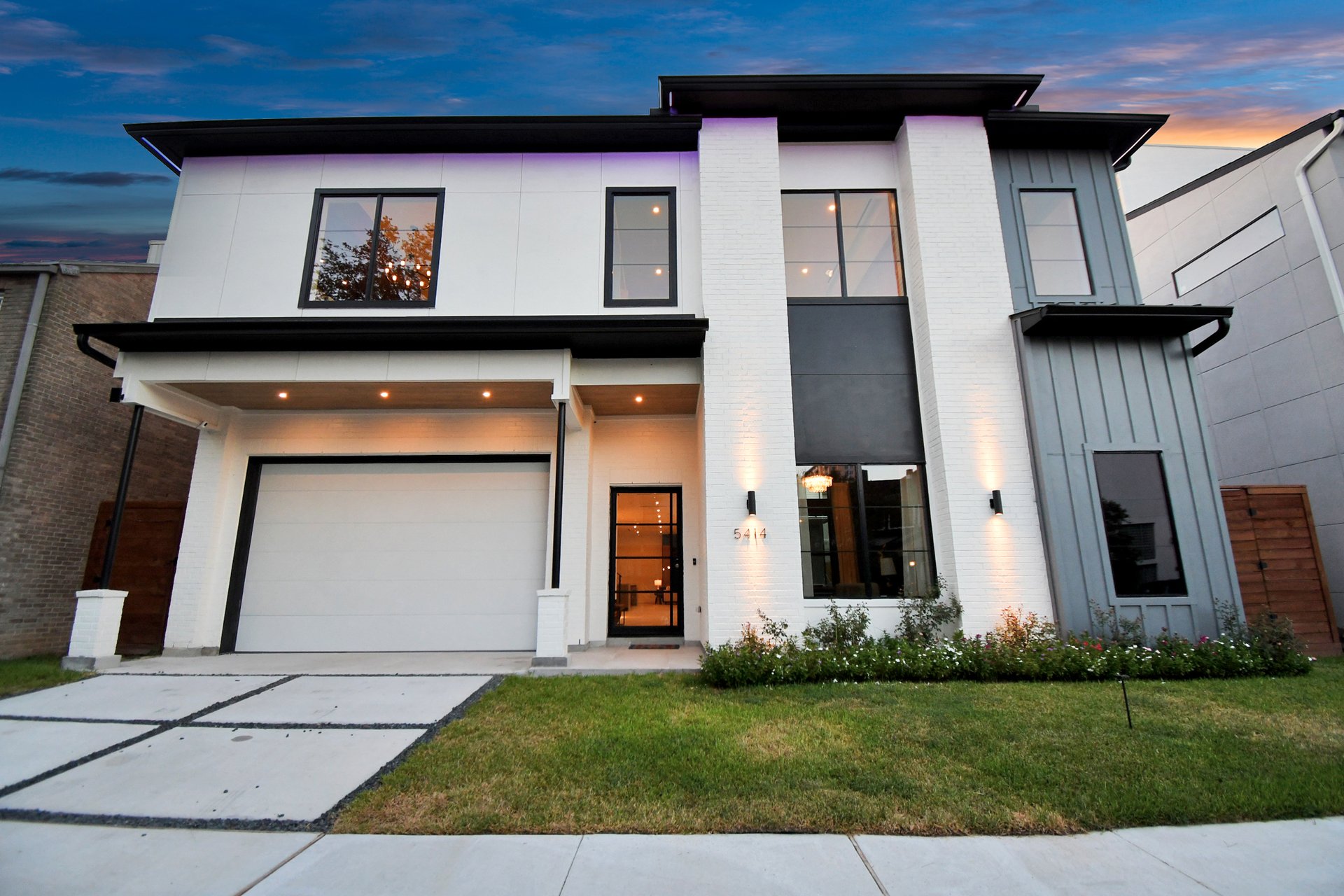 Front facade with modern courtyard architecture at twilight