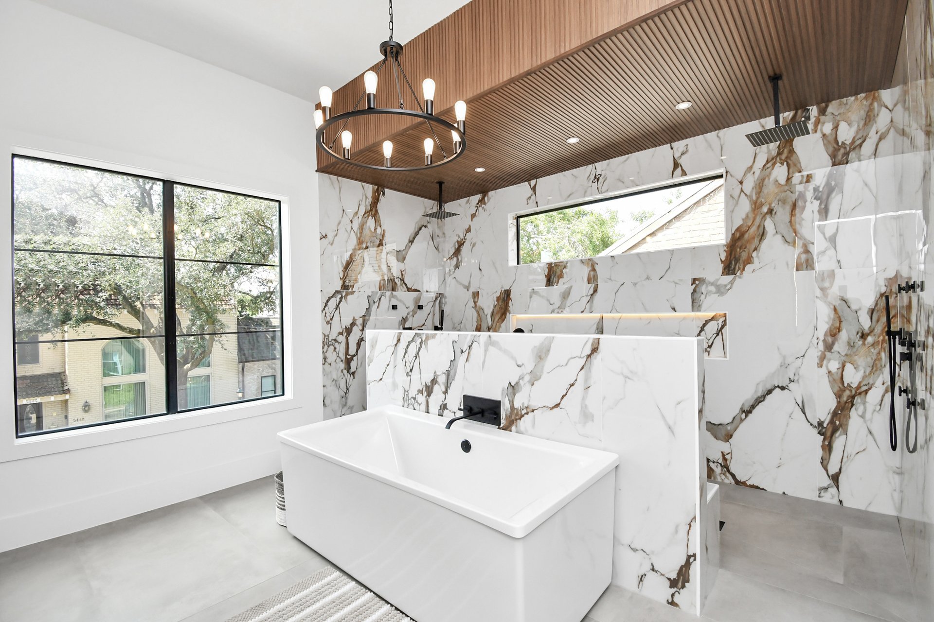 Soaking tub and walk-in shower in the main suite bath